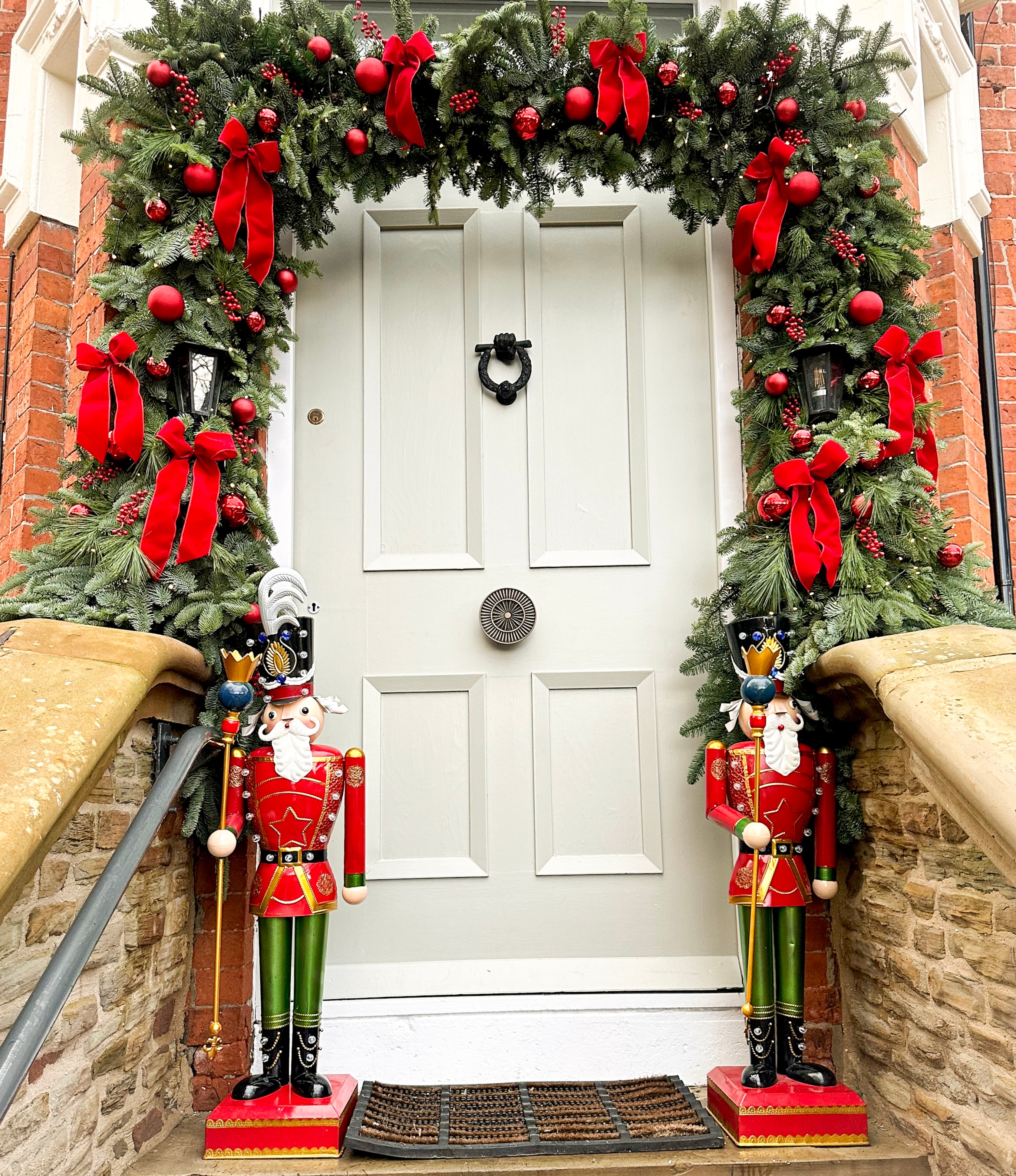 Front door garland arch with nutcrackers