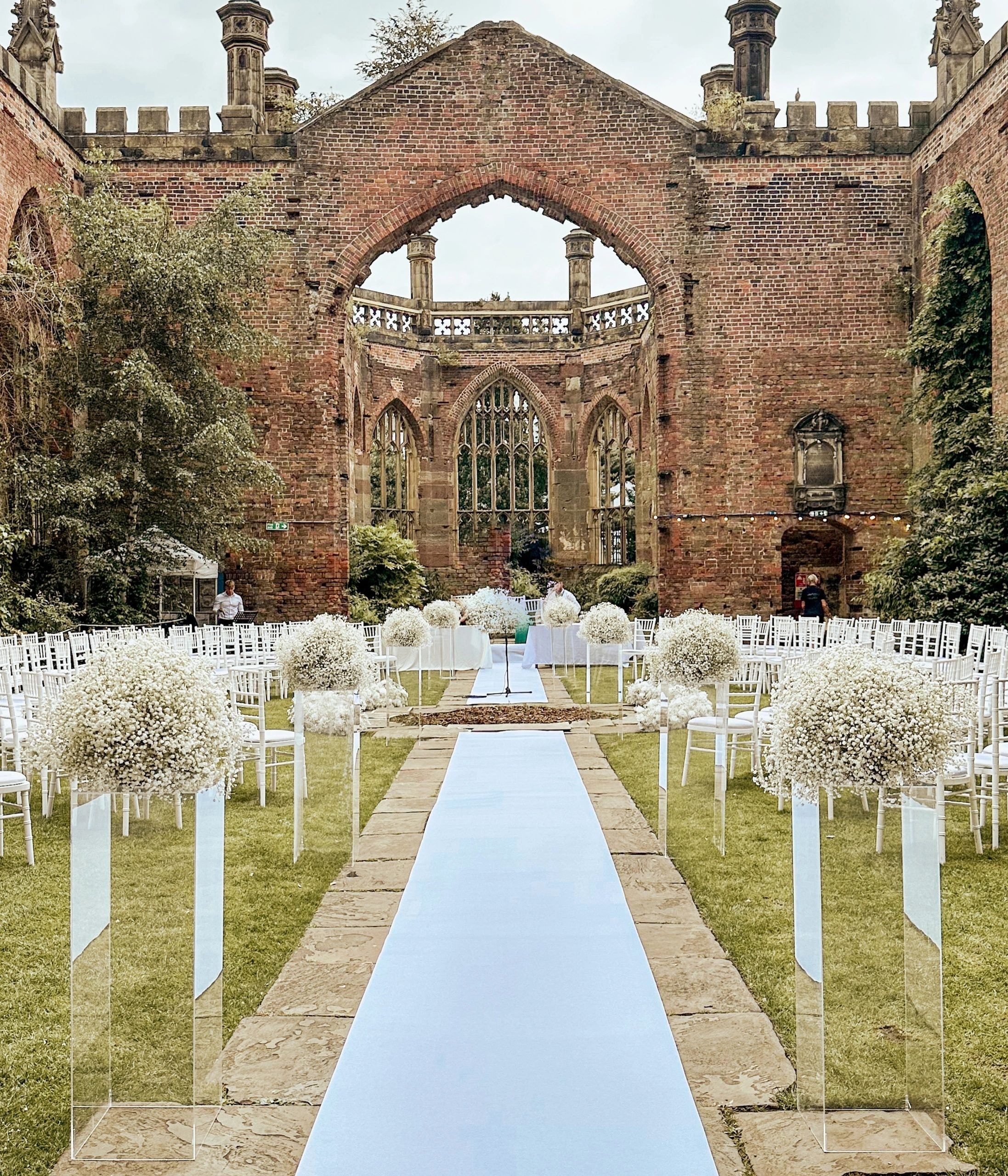 Outdoor ruins wedding ceremony with gypsophila pedestals