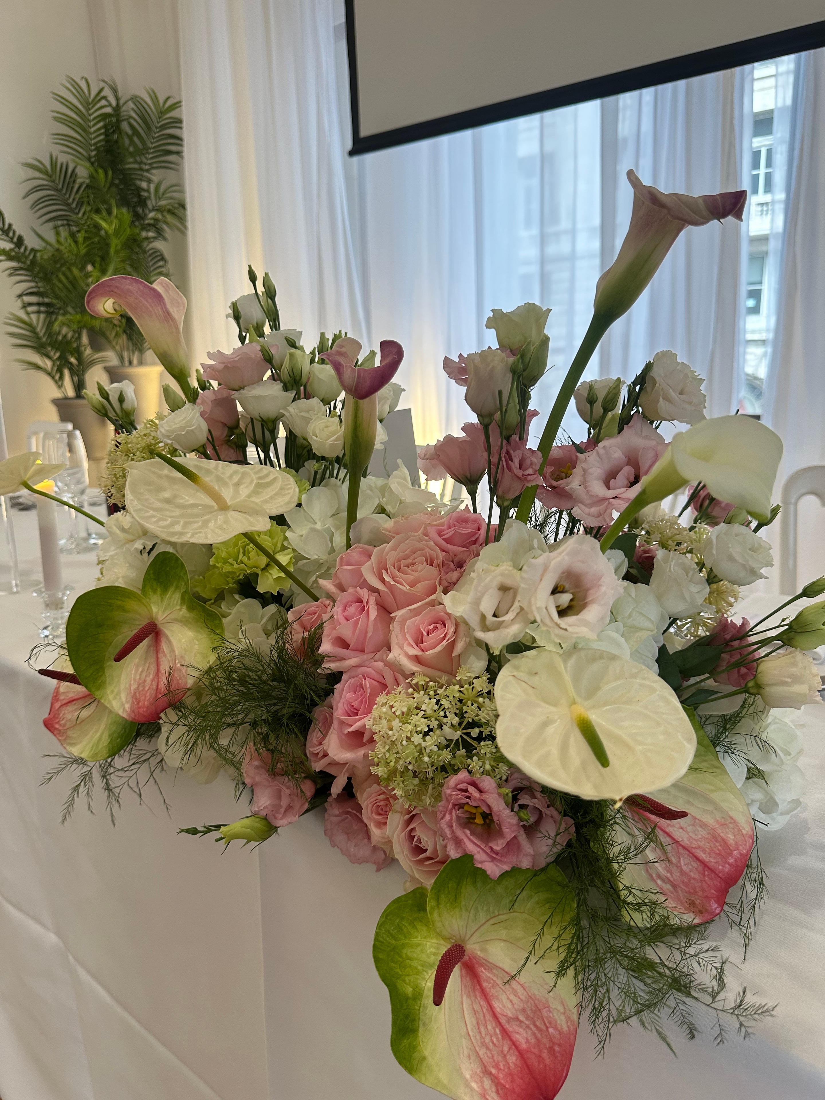 Pink roses anthuriums and calla lily floral arrangement