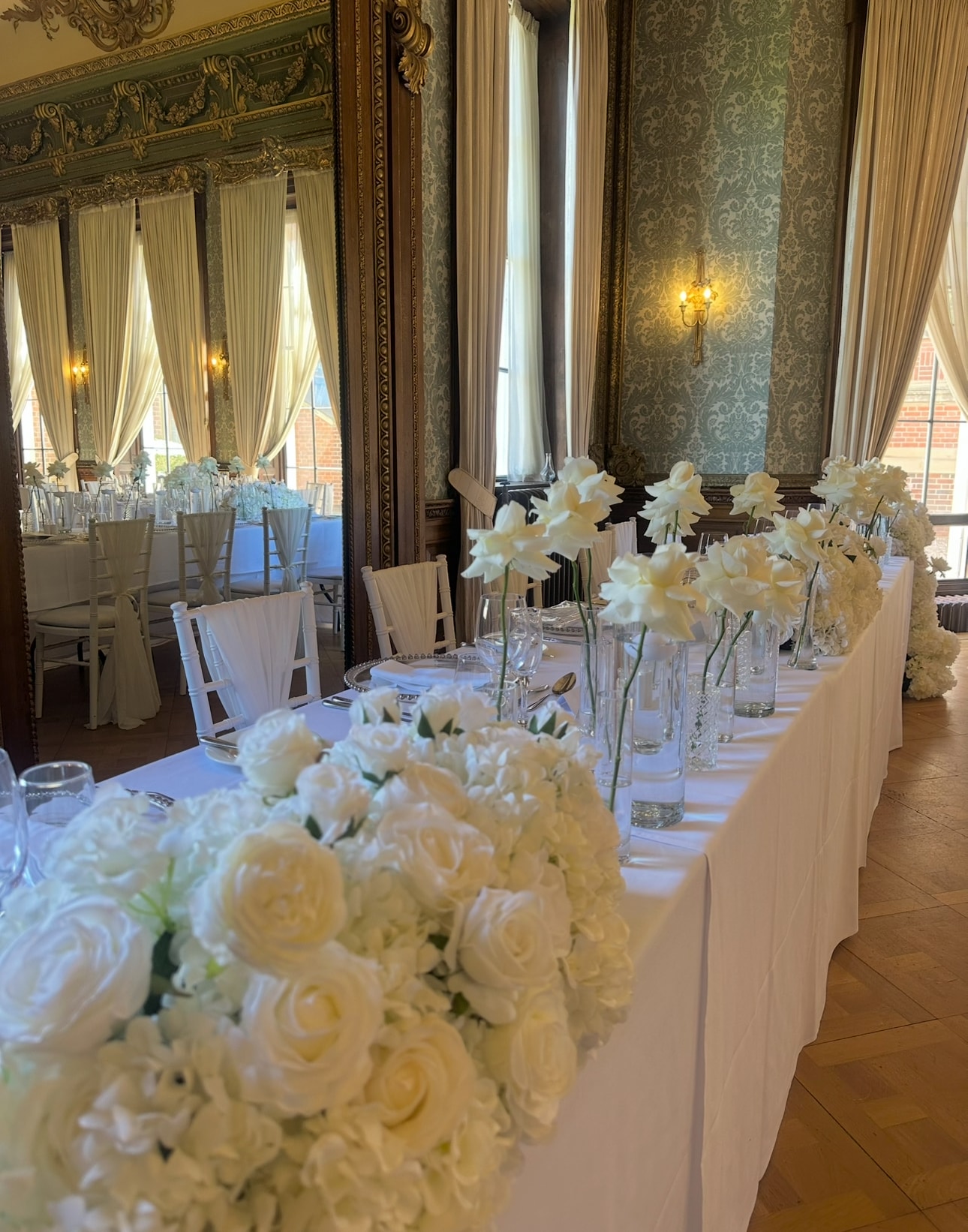 Grand ballroom top table with white orchid and gypsophila garland