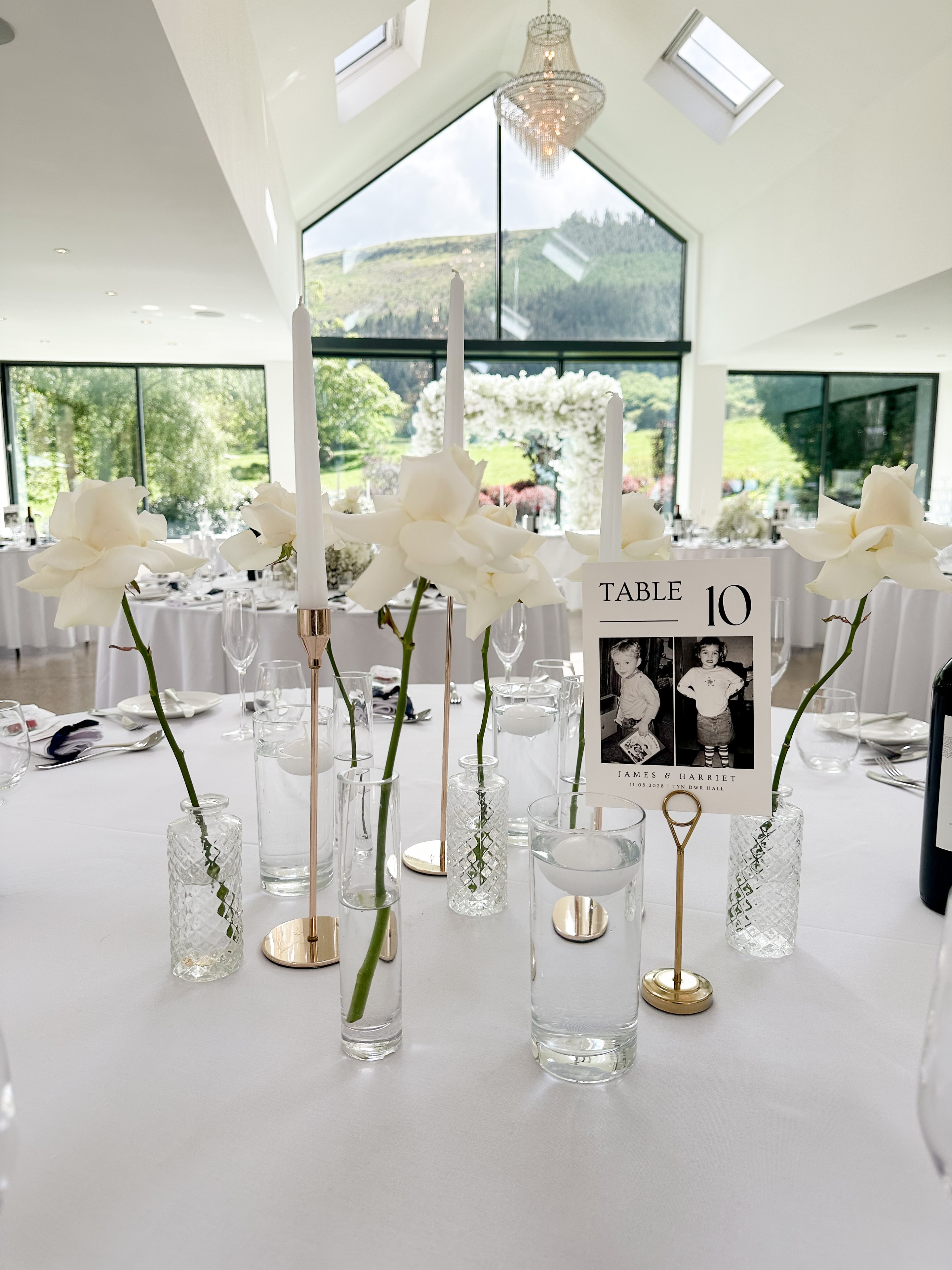 Wedding table with crystal glassware and white flowers
