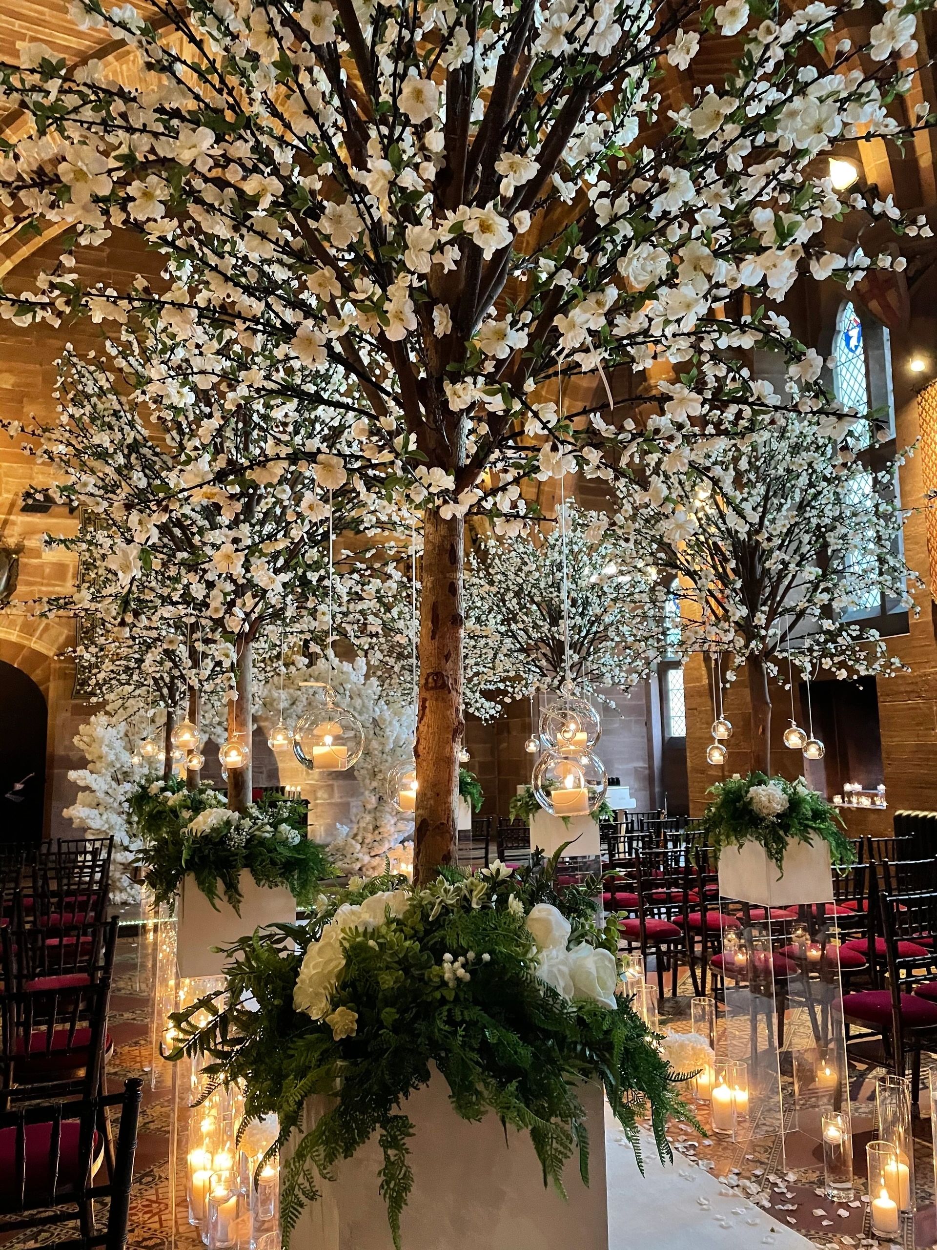 Wedding venue dressed with candles and draping